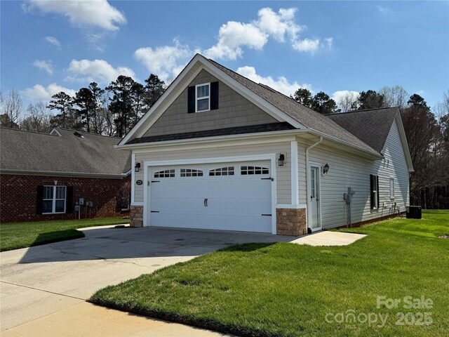 view of property exterior featuring stone siding, a garage, a lawn, and concrete driveway