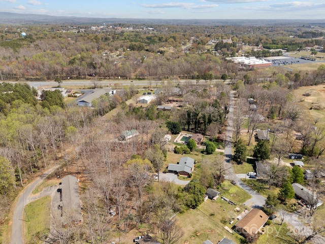 drone / aerial view with a view of trees
