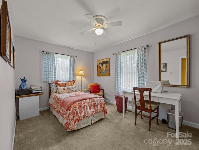 carpeted bedroom featuring a ceiling fan and baseboards