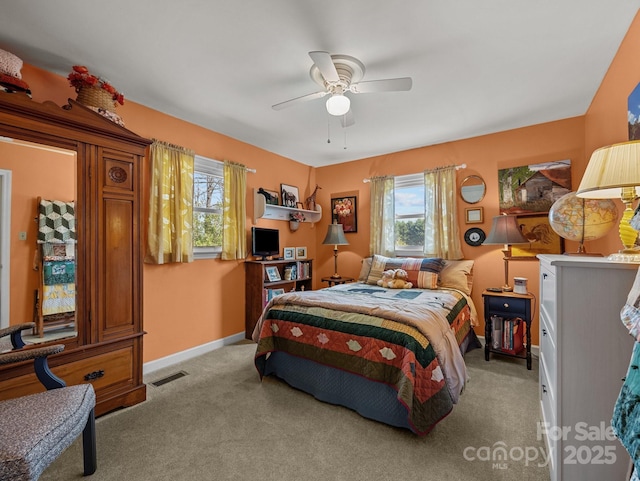 bedroom featuring baseboards, carpet floors, ceiling fan, and visible vents