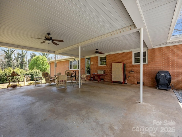 view of patio featuring a grill and ceiling fan