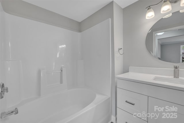bathroom with bathing tub / shower combination and vanity