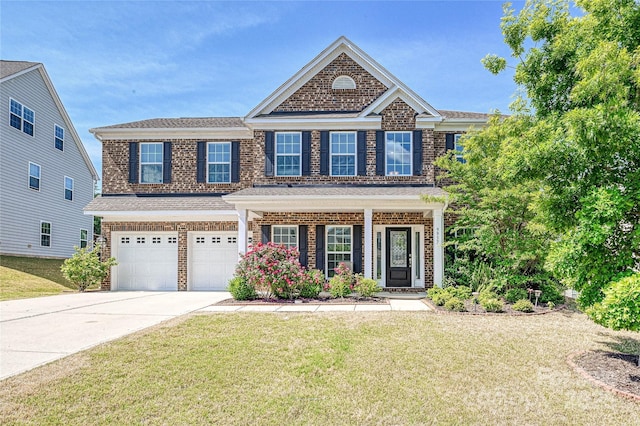 9937 Travertine Trl, Davidson, NC 28036 - view of front of house with concrete driveway, a garage, a front yard, brick siding, and covered porch