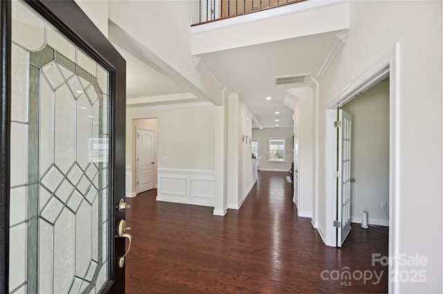 9937 Travertine Trl, Davidson, NC 28036 - foyer with wood finished floors, ornamental molding, and a wainscoted wall