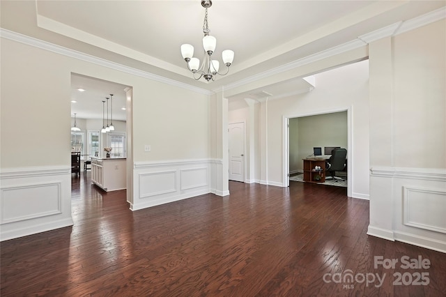 9937 Travertine Trl, Davidson, NC 28036 - unfurnished dining area featuring a chandelier, dark wood finished floors, a desk, a wainscoted wall, and a decorative wall