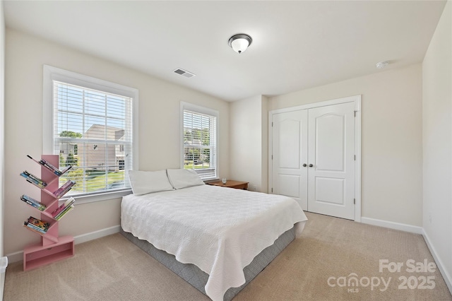 9937 Travertine Trl, Davidson, NC 28036 - bedroom with carpet flooring, baseboards, and a closet