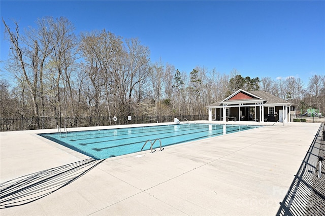 9937 Travertine Trl, Davidson, NC 28036 - community pool with fence, a patio, and view of wooded area