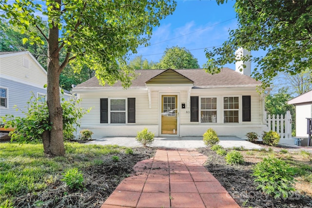 813 N Ave, Charlotte, NC 28208 - bungalow-style house featuring a shingled roof and a chimney