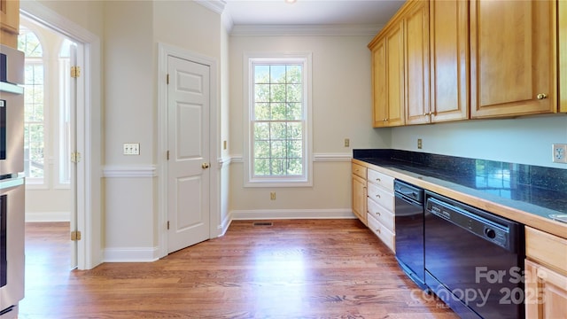kitchen featuring dishwasher, light wood-style floors, light brown cabinetry, dark countertops, and crown molding