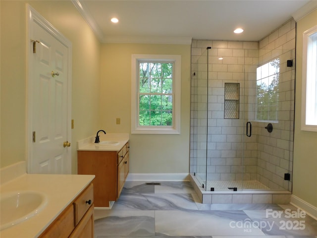 bathroom featuring baseboards, two vanities, a stall shower, crown molding, and recessed lighting