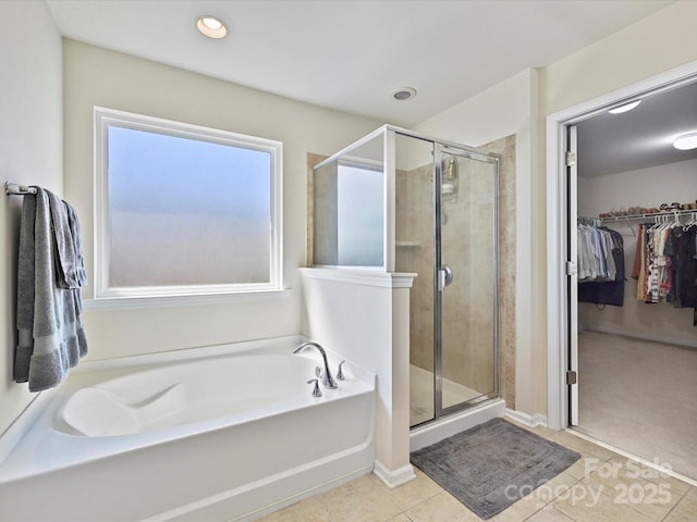 11621 Red Knoll Ln, Pineville, NC 28134 - bathroom featuring a shower stall, tile patterned flooring, a spacious closet, a bath, and recessed lighting