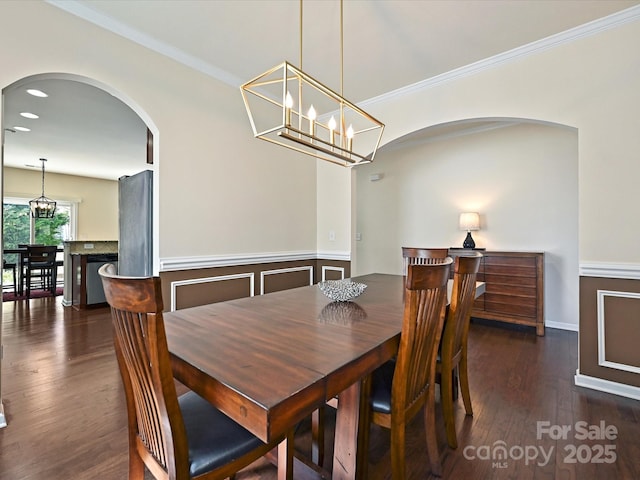 11621 Red Knoll Ln, Pineville, NC 28134 - dining area featuring arched walkways, a chandelier, wood finished floors, crown molding, and recessed lighting