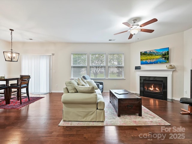 11621 Red Knoll Ln, Pineville, NC 28134 - living room with wood finished floors, a glass covered fireplace, ceiling fan, and baseboards