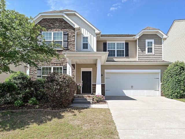 11621 Red Knoll Ln, Pineville, NC 28134 - view of front of property with stone siding, driveway, a garage, and board and batten siding