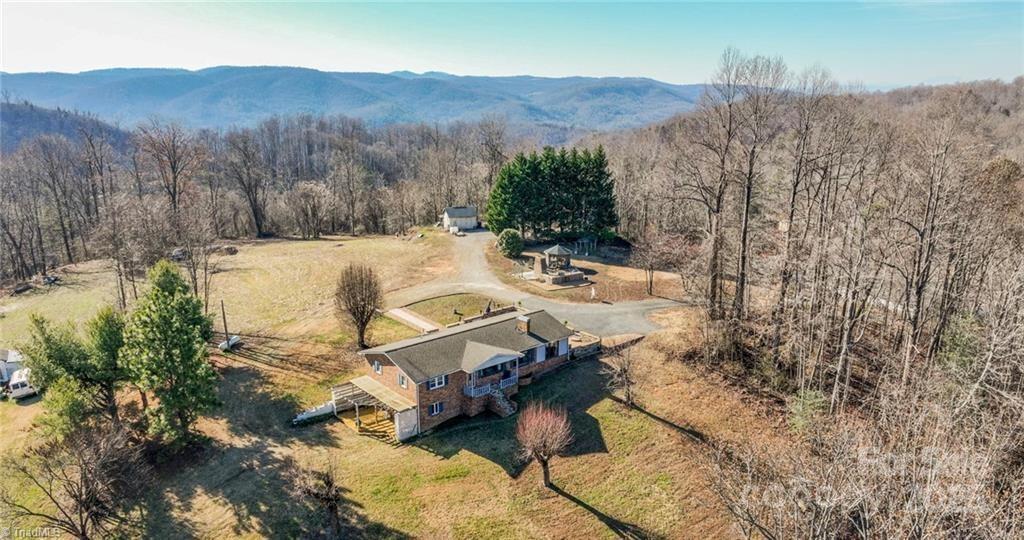 592 Clint Johnson Rd, Wilkesboro, NC 28697 - birds eye view of property with a forest view, a mountain view, and a rural view