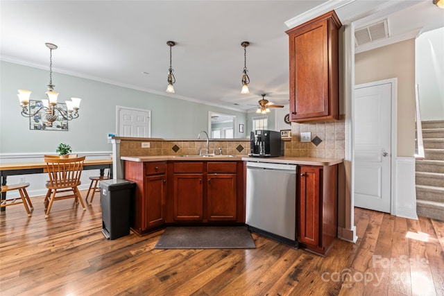 9113 Cinder Ln, Huntersville, NC 28078 - kitchen featuring dark wood-style flooring, stainless steel dishwasher, a sink, visible vents, and a peninsula