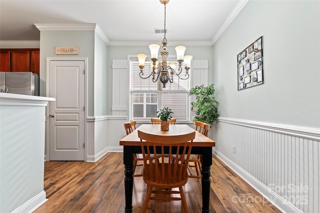 9113 Cinder Ln, Huntersville, NC 28078 - dining room with ornamental molding, a notable chandelier, and dark wood finished floors
