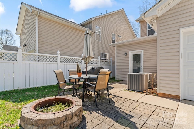 9113 Cinder Ln, Huntersville, NC 28078 - view of patio / terrace featuring outdoor dining space, an outdoor fire pit, central AC, and fence