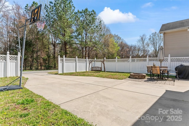 9113 Cinder Ln, Huntersville, NC 28078 - view of patio featuring an outdoor fire pit, grilling area, and fence private yard