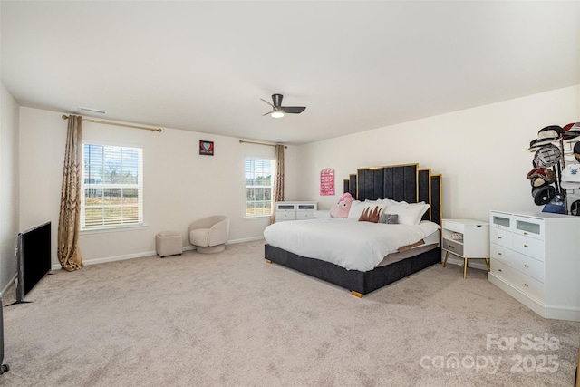 carpeted bedroom with baseboards, ceiling fan, and visible vents