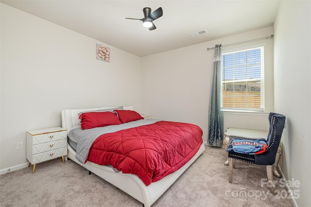carpeted bedroom featuring a ceiling fan, baseboards, and visible vents