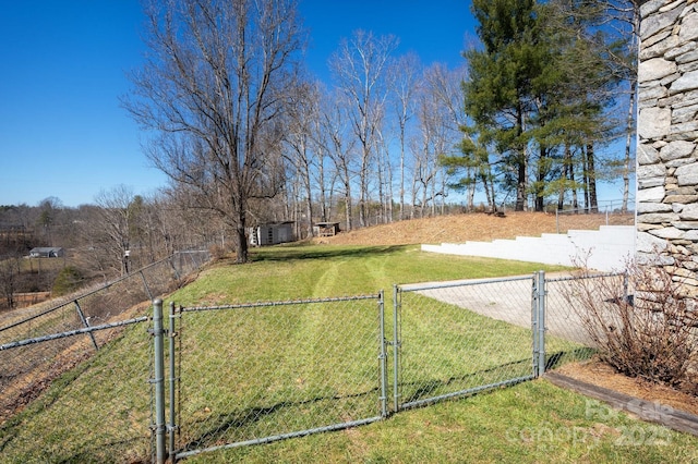 view of yard featuring a gate and fence