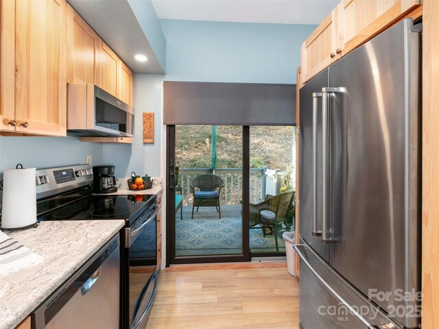 103 Cimarron Dr, Asheville, NC 28803 - kitchen featuring light wood-style flooring, light brown cabinetry, and appliances with stainless steel finishes