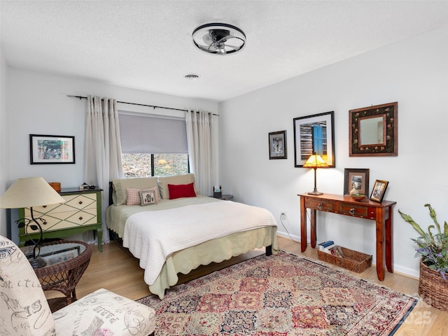 103 Cimarron Dr, Asheville, NC 28803 - bedroom featuring wood finished floors, a textured ceiling, baseboards, and visible vents