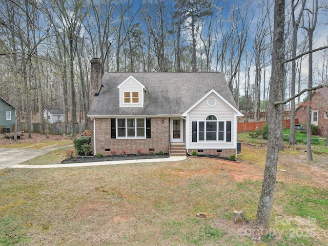 1312 Kensington Pl, Monroe, NC 28112 - new england style home featuring a front lawn, crawl space, a chimney, and fence