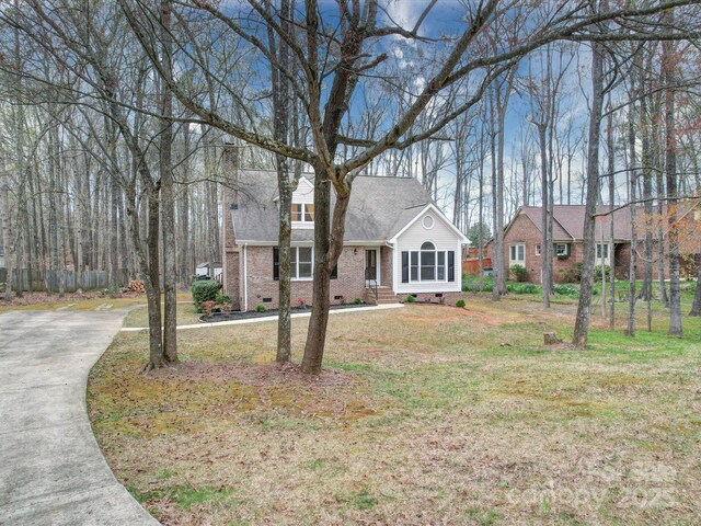 1312 Kensington Pl, Monroe, NC 28112 - view of front facade with a shingled roof, crawl space, a front yard, and brick siding