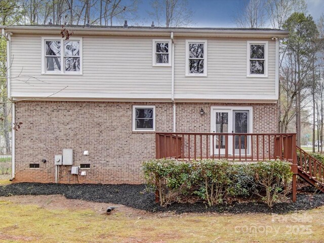 1312 Kensington Pl, Monroe, NC 28112 - rear view of house featuring crawl space, a deck, and brick siding