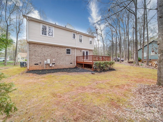 1312 Kensington Pl, Monroe, NC 28112 - back of house with central air condition unit, crawl space, a wooden deck, and a lawn