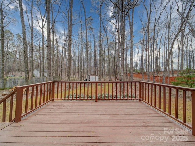 1312 Kensington Pl, Monroe, NC 28112 - wooden deck with a storage unit, an outdoor structure, and fence