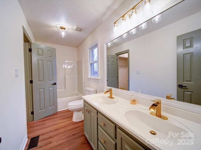 1312 Kensington Pl, Monroe, NC 28112 - full bathroom featuring visible vents, a textured ceiling, a sink, and toilet