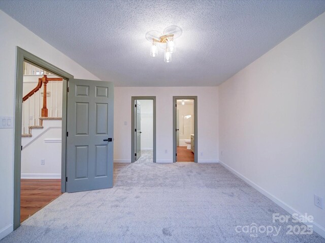 1312 Kensington Pl, Monroe, NC 28112 - bedroom with baseboards, carpet floors, and a walk in closet