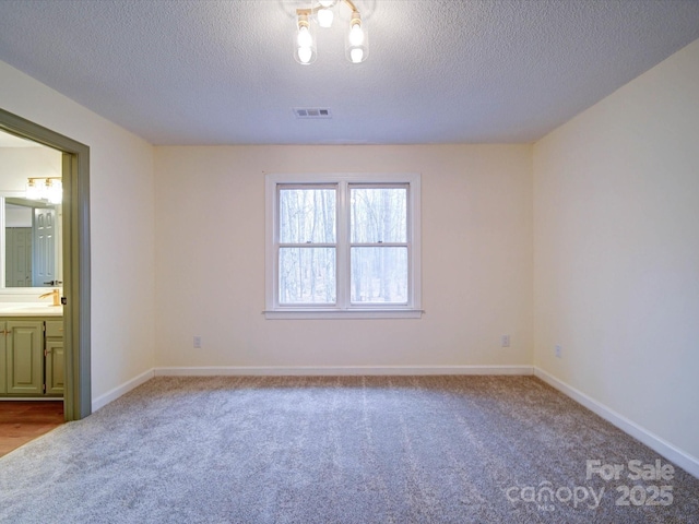 1312 Kensington Pl, Monroe, NC 28112 - unfurnished bedroom featuring ensuite bathroom, carpet, baseboards, and visible vents