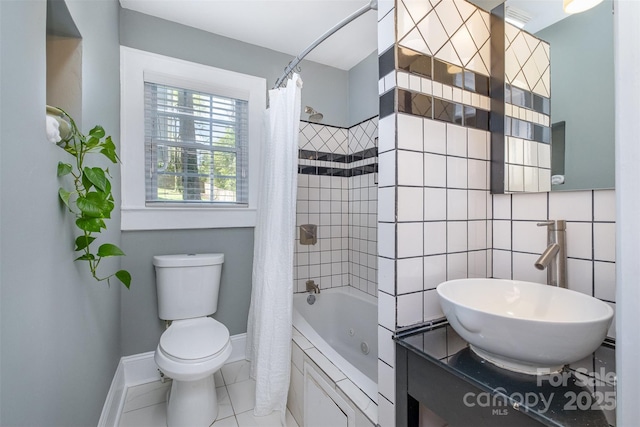 bathroom with toilet, shower / bath combo, baseboards, and vanity