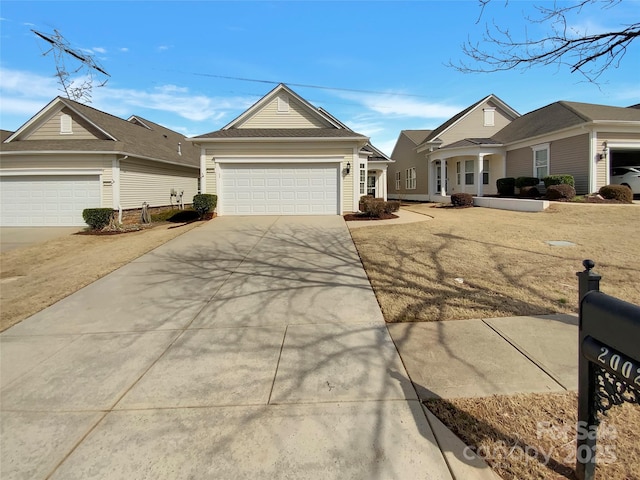 view of front of property featuring a garage and concrete driveway