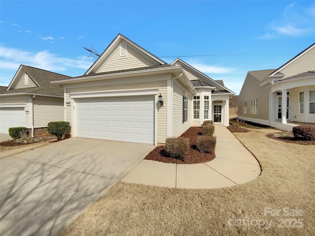 view of front of property with a garage and concrete driveway