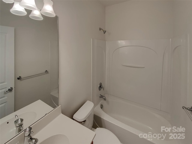 full bath featuring shower / washtub combination, toilet, and vanity