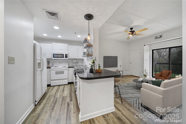 211 Heritage Blvd Unit 301, Fort Mill, SC 29715 - kitchen with open floor plan, visible vents, a peninsula, and white appliances