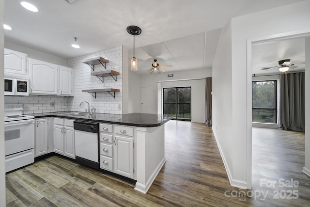 211 Heritage Blvd Unit 301, Fort Mill, SC 29715 - kitchen with white cabinets, dark countertops, a ceiling fan, and white appliances