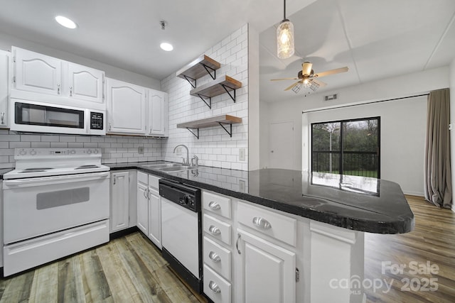211 Heritage Blvd Unit 301, Fort Mill, SC 29715 - kitchen featuring a sink, open shelves, a peninsula, white appliances, and white cabinets