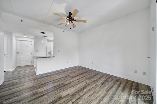 211 Heritage Blvd Unit 301, Fort Mill, SC 29715 - unfurnished living room featuring a ceiling fan, dark wood-type flooring, and baseboards
