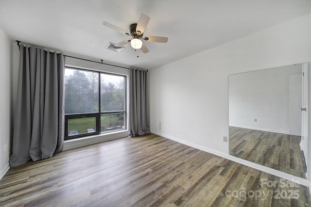 211 Heritage Blvd Unit 301, Fort Mill, SC 29715 - empty room featuring baseboards, visible vents, ceiling fan, and wood finished floors