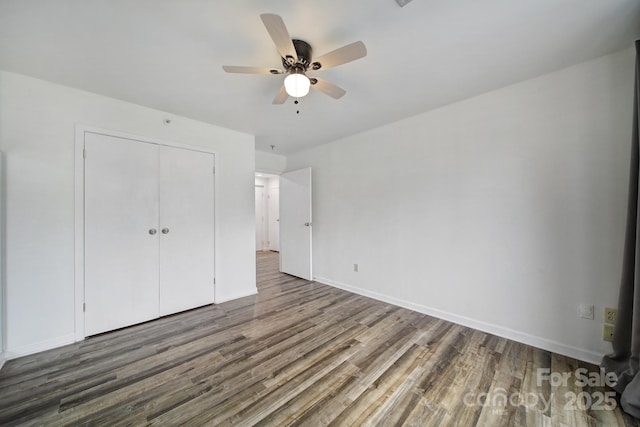 211 Heritage Blvd Unit 301, Fort Mill, SC 29715 - unfurnished bedroom featuring baseboards, a closet, wood finished floors, and ceiling fan