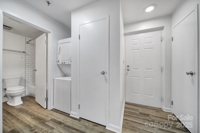211 Heritage Blvd Unit 301, Fort Mill, SC 29715 - laundry room with stacked washing maching and dryer, wood finished floors, and laundry area