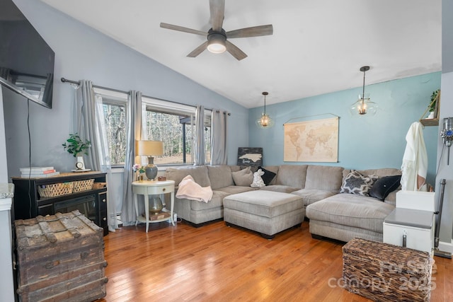3407 14th Ave SW, Hickory, NC 28602 - living area with vaulted ceiling, a ceiling fan, hardwood / wood-style flooring, and baseboard heating