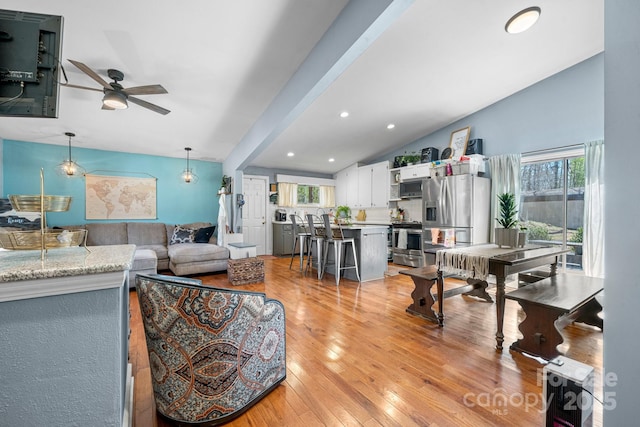 3407 14th Ave SW, Hickory, NC 28602 - living room with vaulted ceiling, healthy amount of natural light, a ceiling fan, light wood-type flooring, and recessed lighting