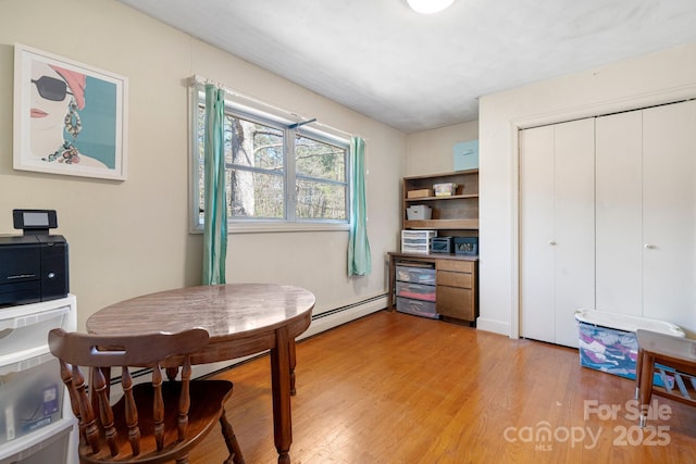 3407 14th Ave SW, Hickory, NC 28602 - dining space featuring a baseboard heating unit and light wood-type flooring